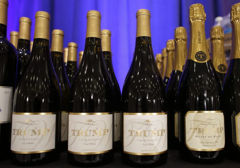 Trump branded wine is displayed prior to a scheduled news conference by Republican presidential candidate Donald Trump, Tuesday, March 8, 2016, in Jupiter, Fla. Trump branded steaks, wine, and water were on display next to the stage at the Trump National Golf Club. (AP Photo/Lynne Sladky)