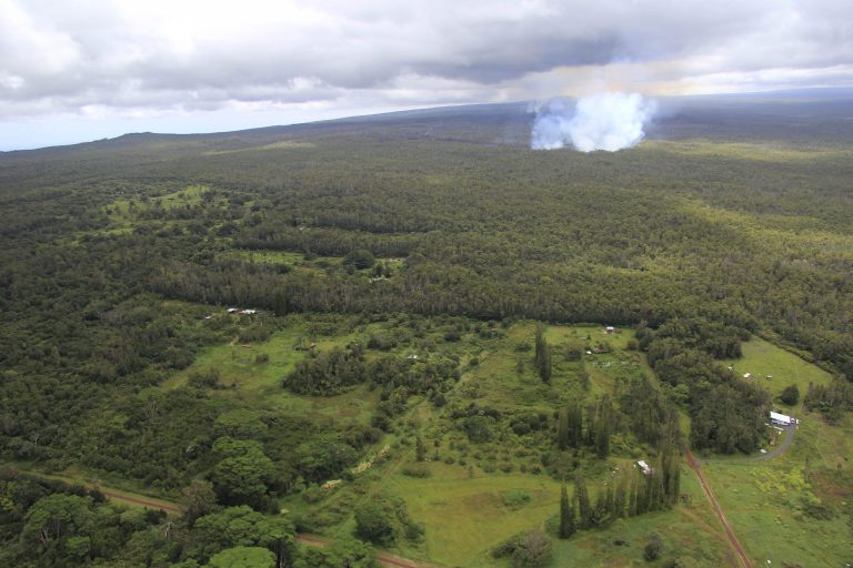 This Monday Sept. 8, 2014, aerial photo provided by the U.S. Geological Survey, shows a smoke plume from the June 27th flow from the Kilauea volcano in Pahoa, Hawaii. Lava from one of the world's most active volcanos has been advancing at a slower pace the past few days and is now moving parallel to a sparsely populated subdivision on Hawaii's Big Island. (AP Photo/U.S. Geological Survey, Tim Orr)
