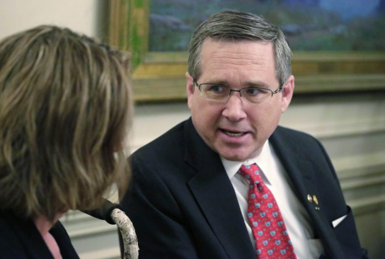 In this March 16, 2015 file photo U.S. Sen. Mark Kirk, R-Ill., speaks to Illinois Republican Senate leader Christine Radogno in Chicago. (AP Photo/M. Spencer Green, File)