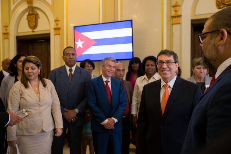 Cuban Foreign Minister Bruno Rodriguez, third from right, speaks with his delegation before a ceremony to re-open the Cuban embassy in Washington, Monday, July 20, 2015. (AP Photo)Â 