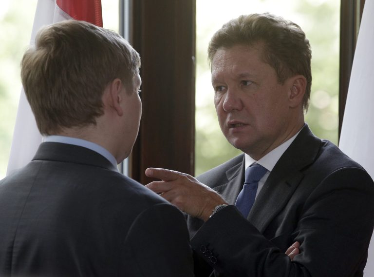 Alexey Miller, right, CEO of the Russian energy supplier Gazprom, speaks to an unidentified delegation member during a meeting of the European Union energy commissioner Guenther Oettinger and Russia's and Ukraine's energy ministers in Berlin, Germany, Monday, May 26, 2014. (AP Photo/Michael Sohn)