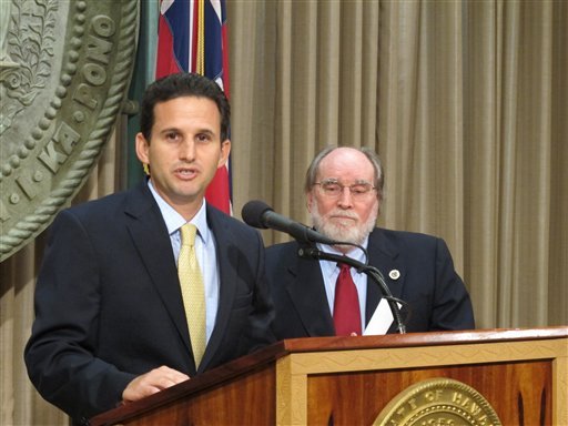 Hawaii Lt. Gov. Brian Schatz speaks the state Capitol in Honolulu on Wednesday, Dec. 26. 2012 after Gov. Neil Abercrombie, right, announced he was appointing Schatz to fill the seat vacated by the late U.S. Sen. Daniel Inouye. (AP Photo/Audrey McAvoy)