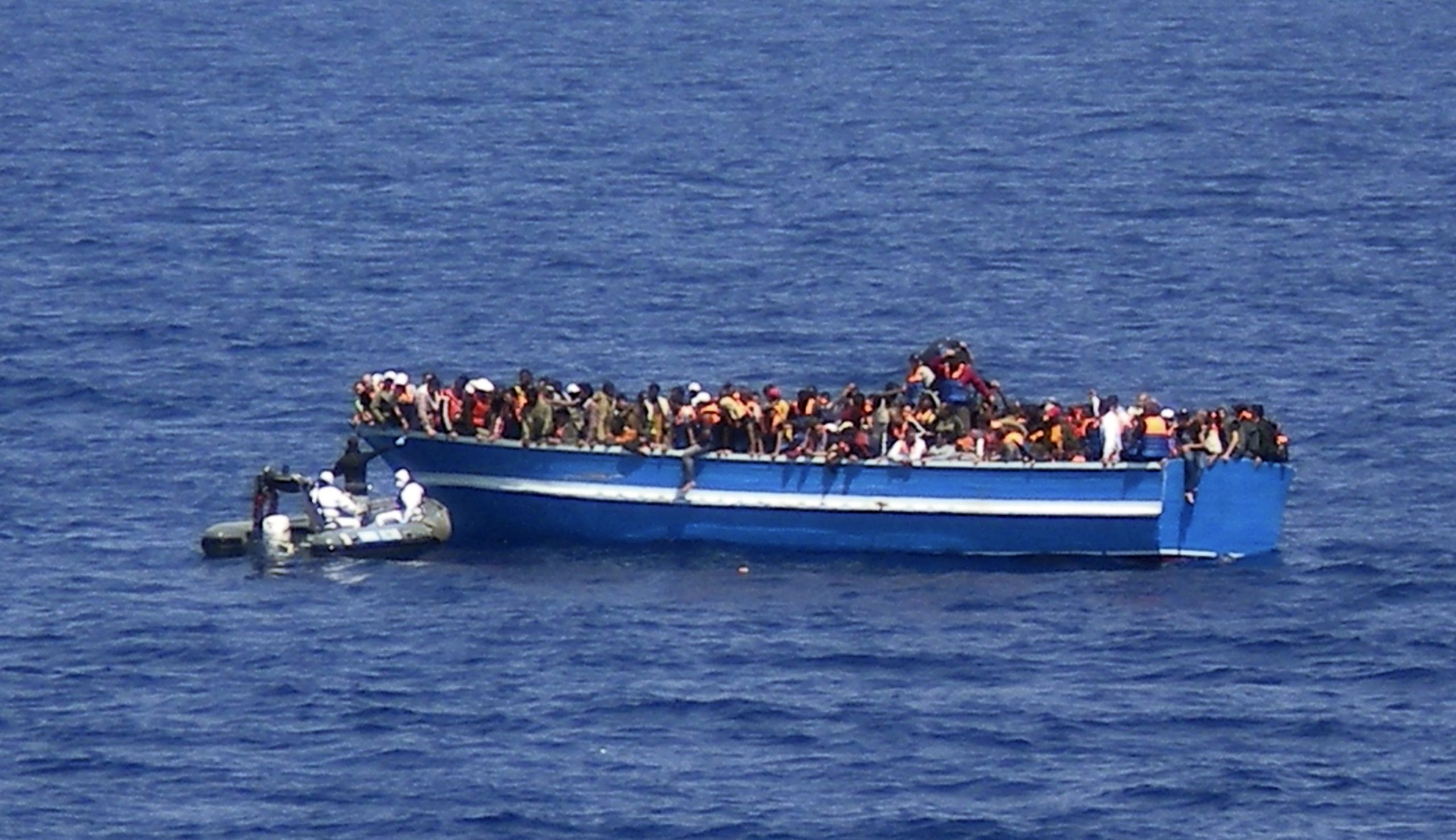 Aid groups dock two rescue vessels with 500 migrants in Italy