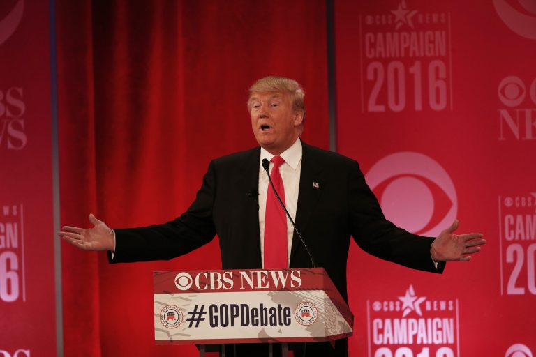 Republican presidential candidate Donald Trump sought Sunday to walk back his statements during Saturday night's Republican debate that former President George W. Bush bore responsibility for the Sept. 11 terror attacks. (AP Photo/John Bazemore)