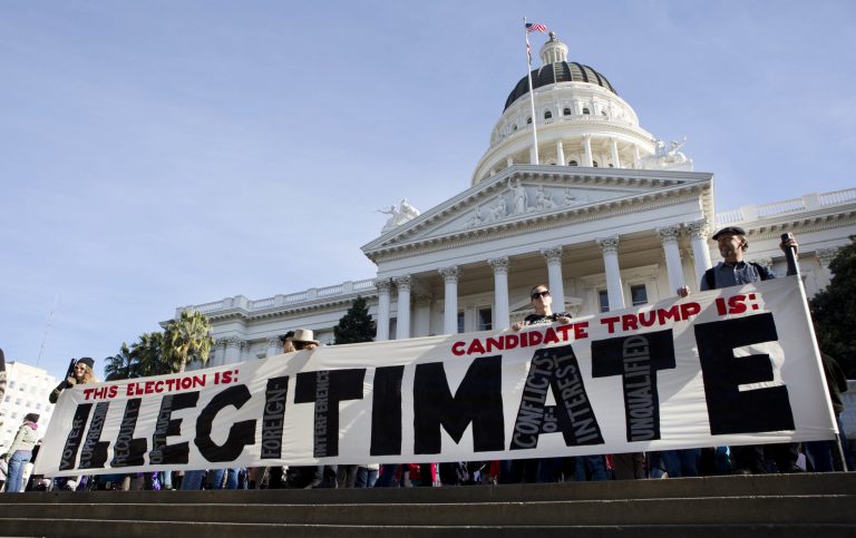 Democrats still mourning the outcome of last month's election have added a new step to their grieving process: leveling charges of racism against those who support the constitutional method of electing the president. (AP Photo/Steve Yeater)