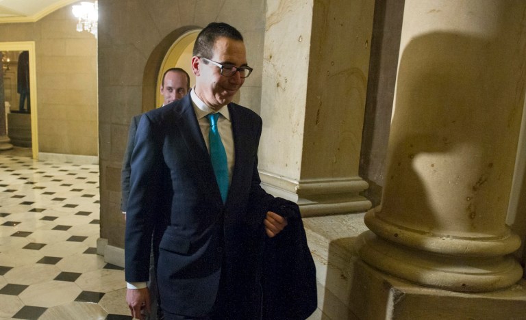 Former Goldman Sachs banker will face questions about taxes, financial regulation and the federal debt. (AP Photo/Cliff Owen)