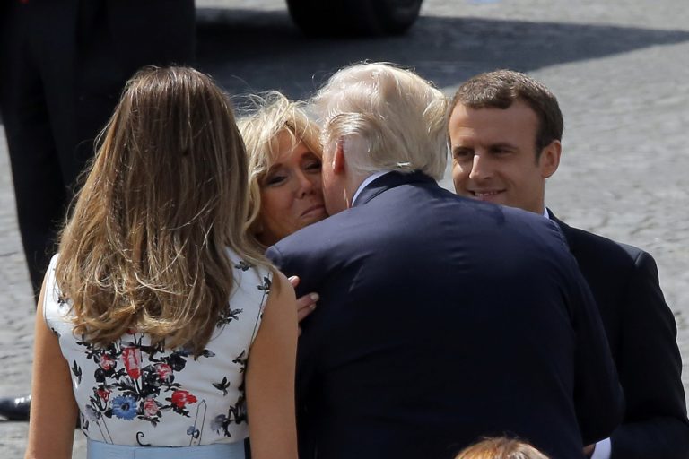 U.S. President Donald Trump and U.S. First Lady Melania Trump, left, bid adieu to Brigitte Macron, second left, and French President Emmanuel Macron, right, at the end of the traditional Bastille Day military parade on the Champs Elysees, in Paris, Friday, July 14, 2017. (AP Photo/Michel Euler)