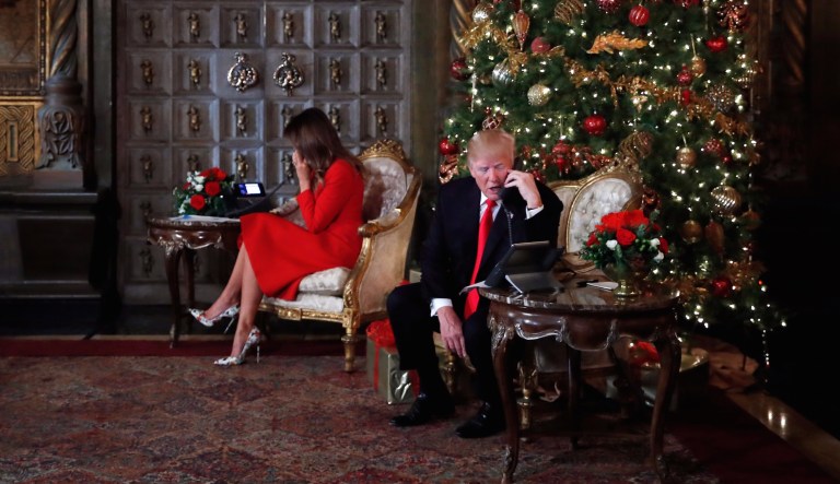 President Trump and first lady Melania Trump spoke on the phone with children as they track Santa Claus' movements with the North American Aerospace Defense Command, NORAD, Santa Tracker on Christmas Eve at the president's Mar-a-Lago estate in Palm Beach, Fla. (AP Photo/Carolyn Kaster)