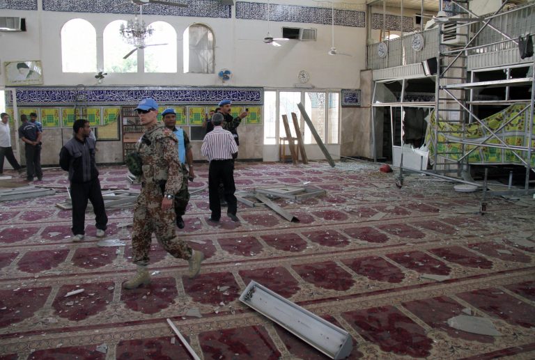   UN observers inspect the prayer hall of the Sayyida Zeinab shrine which was damaged after a car bomb exploded near the shrine, in a suburb of Damascus, Syria, Thursday June 14, 2012. A car bomb exploded Thursday in a Damascus suburb that is home to a popular Shiite Muslim shrine, wounding at least two people, Syria's state-run news agency SANA reported, while activists said regime troops continued shelling rebellious areas in central Homs province. (AP Photo/Bassem Tellawi)  