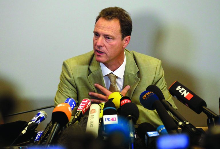 Annecy prosecutor Eric Maillaud answers a question during a news conference in Annecy, France, Friday, Sept. 7, 2012. Maillaud said that the 4-year-old girl who survived the slaying of her family in Annecy couldn't help their investigation since she hid under her mother's legs during the killings. (AP Photo/Lionel Cironneau)