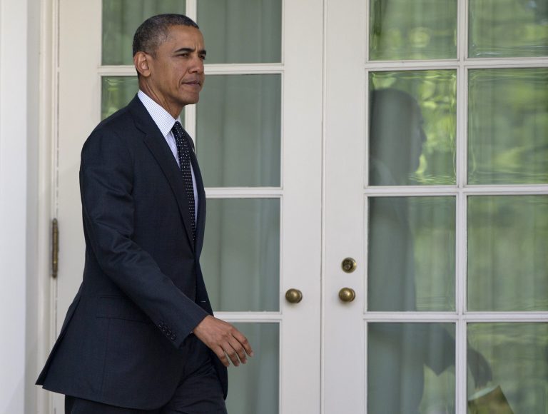 President Barack Obama walks to the Rose Garden of the White House in Washington, Tuesday, May 27, 2014, to speak about the future of US troops in Afghanistan, Tuesday, May 27, 2014. The president will seek to keep 9,800 US troops in Afghanistan after the war formally ends later this year and then will withdraw most of those forces by the end of 2016.(AP Photo/Carolyn Kaster)