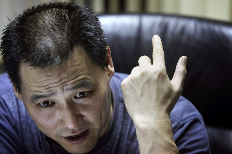 In this photo taken Wednesday, June 30, 2010, Chinese attorney Pu Zhiqiang speaks during an interview at his office in Beijing, China. Police on Friday, June 13, 2014 formally arrested the rights lawyer who is well known in China for his efforts to defend free speech, abolish labor camps and publicize abuses by police and Communist Party officials. (AP Photo/Ng Han Guan)