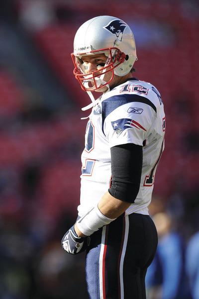 LANDOVER, MD-DECEMBER 11: Tom Brady#12 of the New England Patriots warms up before a game against the Washington Redskins at FedExField on December 11, 2011 in Landover, Maryland.(Photo by Patrick McDermott/Getty Images)