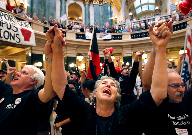 Mary Kay Baum joins hundreds of labor union members at a rally to protest the collective bargaining measures of Wisconsin Governor Scott Walker's administration at the Wisconsin State Capitol Building in Madison, Wis., in 2011. (AP Photo/Wisconsin State Journal, John Hart)