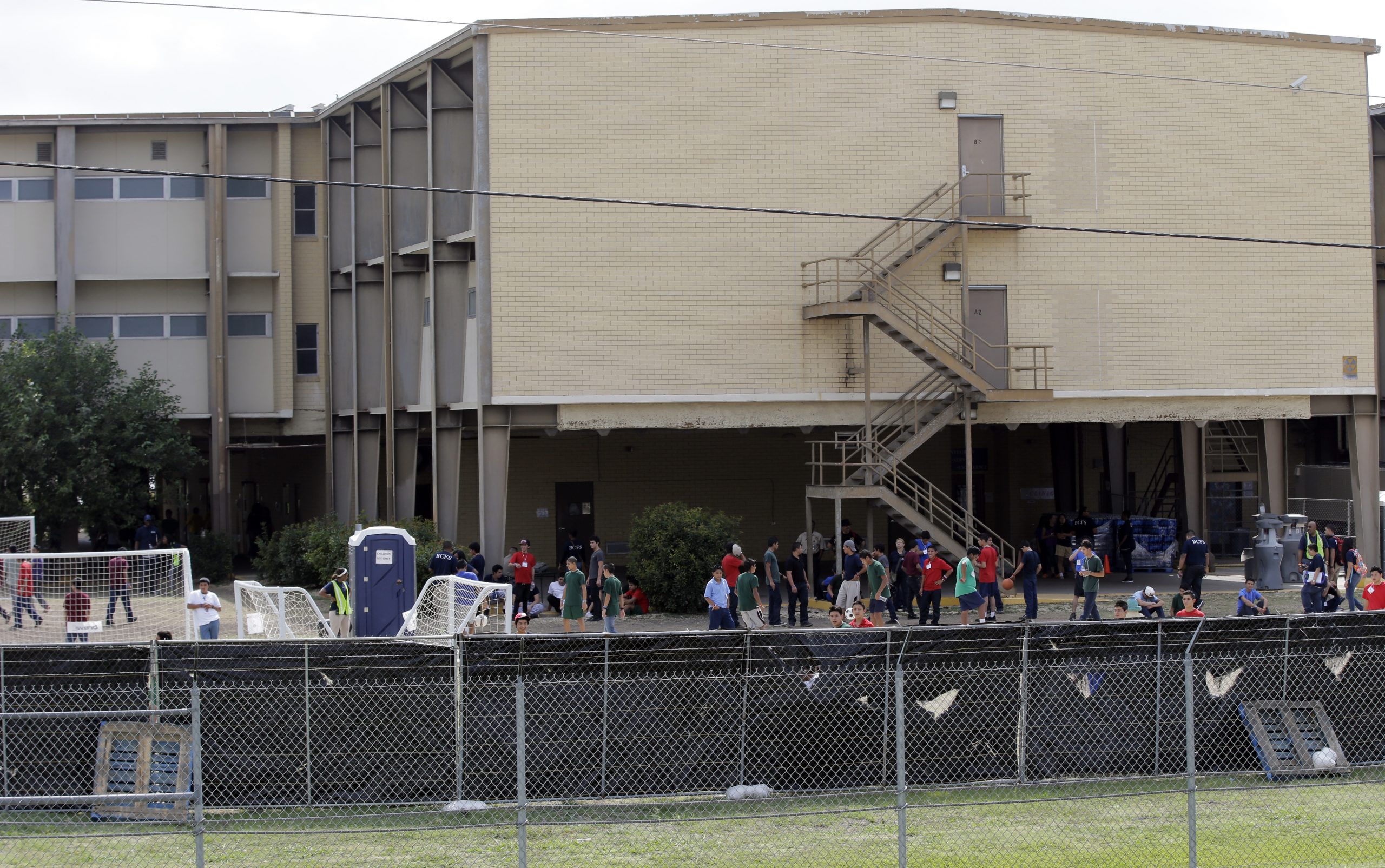 Texas politicians tour base with immigrant kids