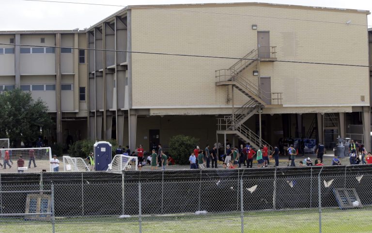 A temporary shelter for unaccompanied minors who have entered the country illegally is seen at Lackland Air Force Base, Monday, June 23, 2014, in San Antonio. U.S. Sen. Ted Cruz, U.S. Rep Michael Bachmann, and Attorney Gen. and Republican gubernatorial candidate Greg Abbott toured the facility Monday. Cruz and Abbott are ramping up criticism of President Barack Obama for more than 52,000 unaccompanied minors who have poured across the southwestern border of the U.S. in recent months. (AP Photo/Eric Gay)