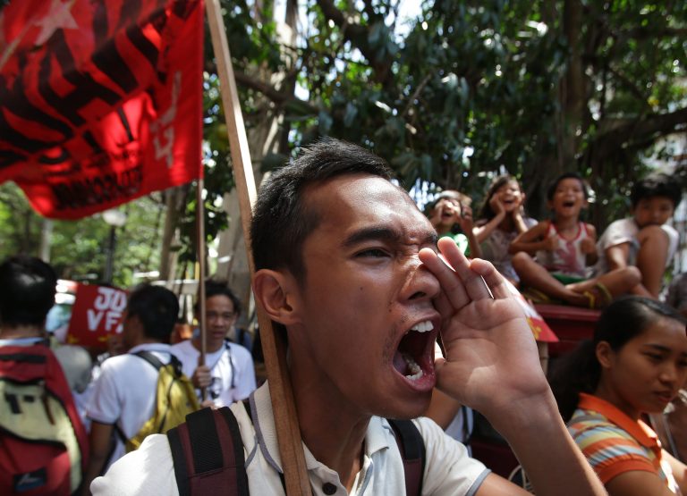 A Filipino protester shouts slogans as they march near the U.S. embassy during a rally to oppose the planned visit of U.S. President Barack Obama in Manila, Philippines on Wednesday Oct. 2, 2013. Obama has canceled two stops, Malaysia and Philippines, on his long-planned trip to Asia because of the partial government shutdown, the White House announced Wednesday. (AP Photo/Aaron Favila)