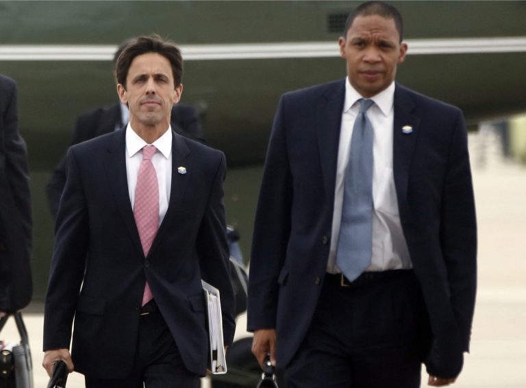 In this Oct. 30, 2013, photo, David Simas, Deputy Senior Adviser for Communications and Strategy, left, and Rob Nabors, Deputy Chief of Staff accompany President Barack Obama to board Air Force One at Andrews Air Force Base, Md., as he travels to Boston to speak about the federal health care law. Obama is bringing back an internal White House political office as this year's congressional election approaches. Obama announced Jan. 24, 2014, that he's named Simas, a top adviser grappling with problems with his health care rollout, to oversee a new Office of Political Strategy and Outreach.(AP Photo/Charles Dharapak)