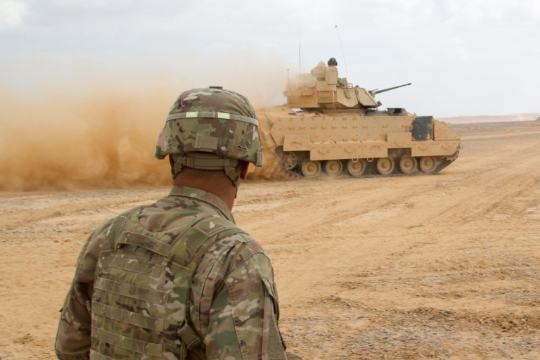 A Bradley fighting vehicle maneuvers during an exercise at Joint Training Center in Jordan in May. Three U.S. service members were killed Friday after a shootout at Jordan's Prince Faisal Air Base. (U.S. Army photo)