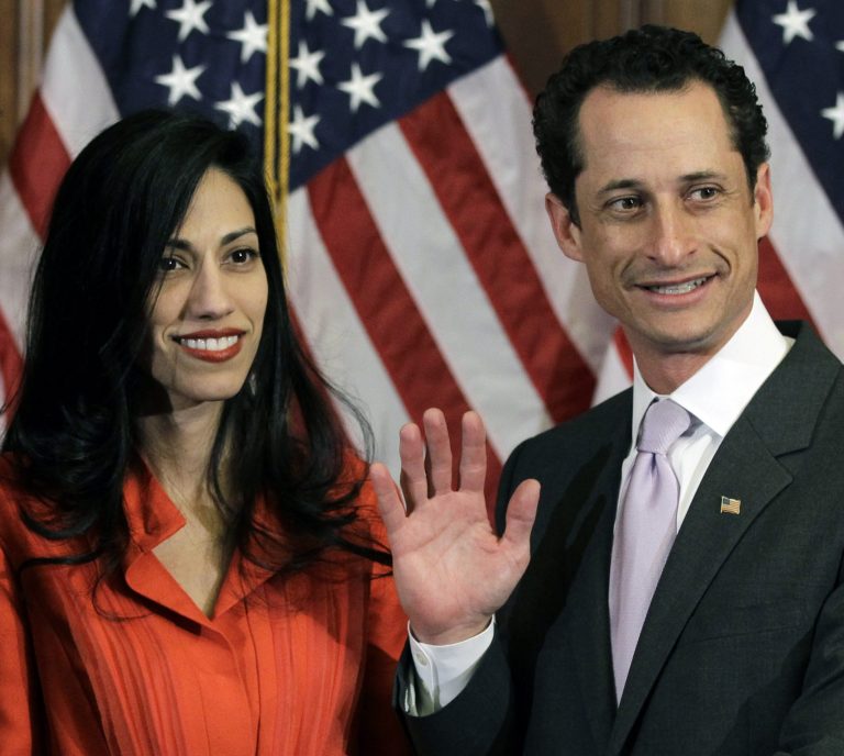 Anthony Weiner and his wife Huma Abedin pose for photographs in 2011.  (AP/Charles Dharapak)