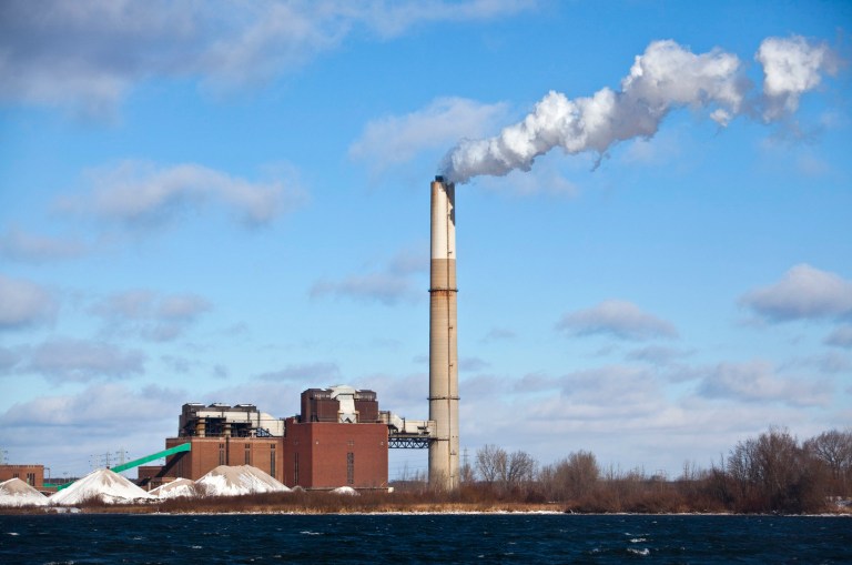 FILE- In this Dec. 13, 2010, file photo, Consumer Energy's B.C. Cobb Plant in Muskegon, Mich. is shown. The federal government says CMS Energy Corp. will undertake an estimated $1 billion program to cut emissions from five coal-fired power plants in Michigan to settle air pollution complaints. The U.S. Department of Justice announced Tuesday, Sept. 16, 2014 that the utility's Consumers Energy subsidiary agreed to a plan to cut 46,500 tons of sulfur dioxide and other emissions annually from plants in Essexville, Luna Pier, Muskegon and West Olive. (AP Photo/The Muskegon Chronicle, Jeffrey Ball, File)