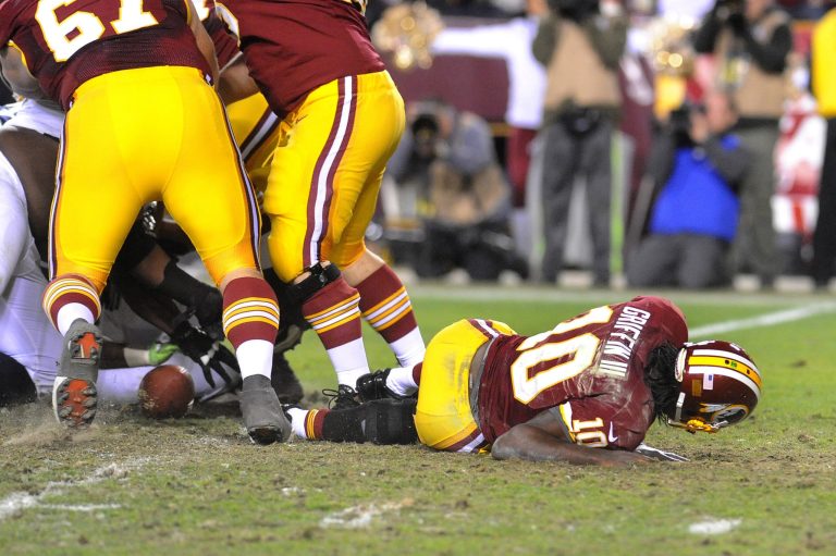 Richard Lipski/AP
Redskins quarterback Robert Griffin III tore ligaments in his knee after being sent out to play while injured in Washington's playoff loss to Seattle in January.