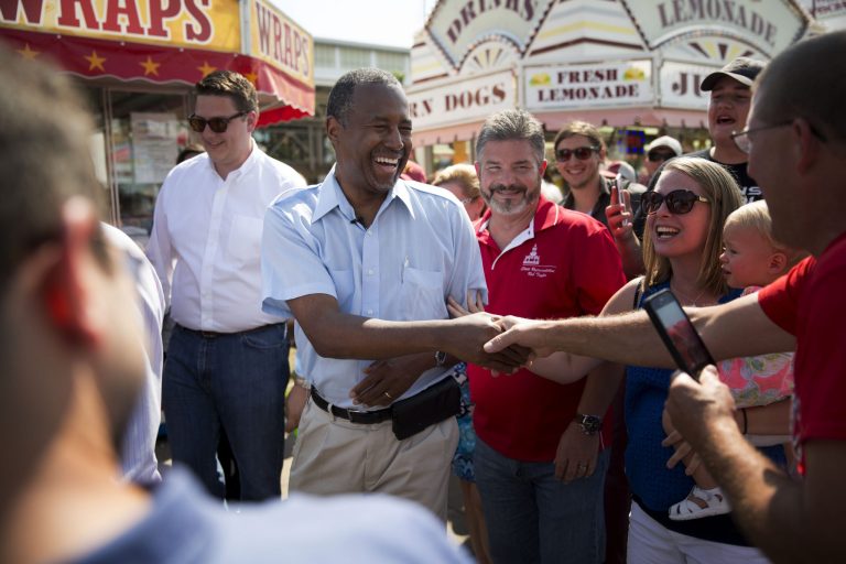 Ben Carson, 2016 Republican presidential candidate, center, greets attendees as he tours the Iowa State Fair in Des Moines, Iowa, U.S., on Sunday, Aug. 16, 2015. (Daniel Acker/Bloomberg)