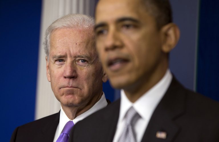   Vice President Joe Biden, left, listens as President Barack Obama announces that Biden will lead an administration-wide effort to curb gun violence in response to the Connecticut school shooting, during a news conference in the briefing room of the White House on Wednesday, Dec. 19, 2012 in Washington. (AP Photo/ Evan Vucci)  