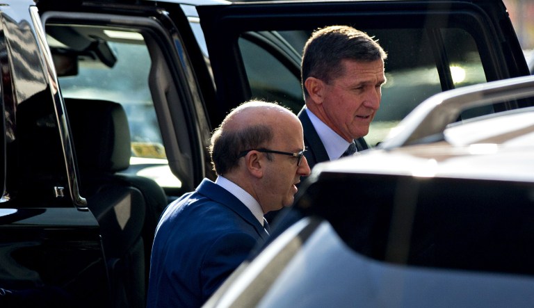 Michael Flynn, U.S. national security advisor, right, exits a vehicle outside the U.S. Courthouse in Washington, D.C., U.S., on Friday, Dec. 1, 2017. Flynn, who was fired as President Donald Trump's national security adviser after revelations that he lied about his communications with Russia's ambassador, is expected to plead guilty Friday morning to lying to federal agents about the contact. Photographer: Andrew Harrer/Bloomberg