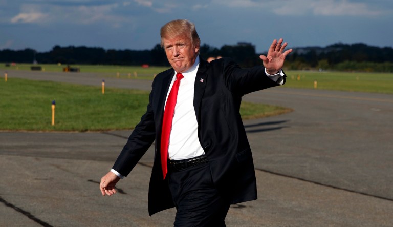 President Trump is attempting to dismiss a lawsuit alleging his failure to divest himself from his business interests has caused him to violate the Emoluments Clause (AP Photo/Evan Vucci)