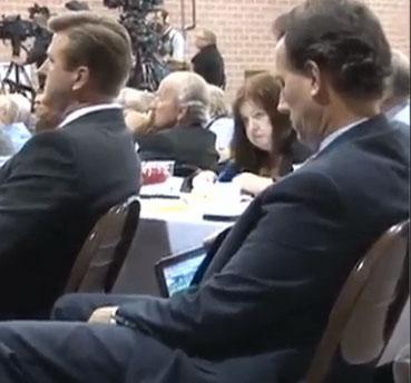 Santorum watching football during Newt speech