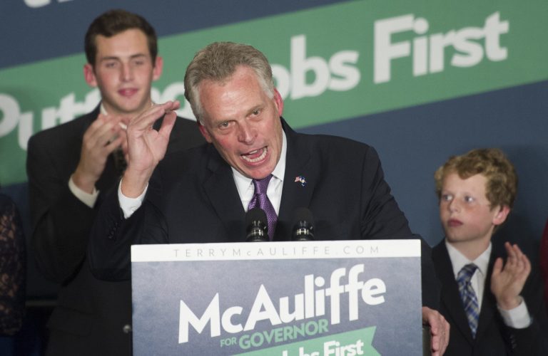 Virginia Democratic Governor-elect Terry McAuliffe address his supporters as his sons Jack, 20, left, and Peter, 11, right, look on during an election victory party in Tysons Corner, Va. (AP Photo/Cliff Owen)