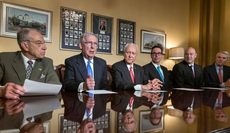 From left, Senate Judiciary Committee Chairman Chuck Grassley, R-Iowa, Senate Majority Leader Mitch McConnell, R-Ky., Senate Finance Committee Chairman Orrin Hatch, R-Utah, Treasury Secretary Steven Mnuchin, President Donald Trump's top economic adviser Gary Cohn, and Sen. Rob Portman, R-Ohio, speak at a news conference as work gets underway on the Senate's version of the GOP tax reform bill, on Capitol Hill in Washington, Thursday, Nov. 9, 2017. (AP Photo/J. Scott Applewhite)