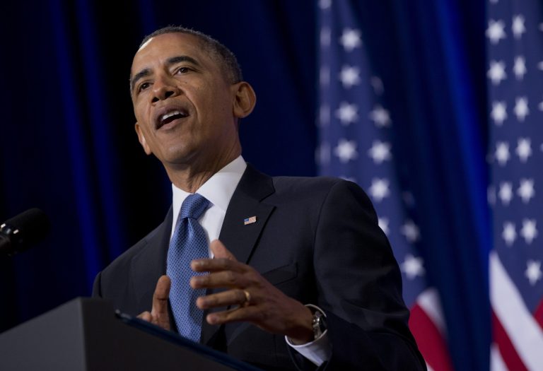 President Barack Obama talks about National Security Agency (NSA)surveillance, Friday, Jan. 17, 2014, at the Justice Department in Washington.Seeking to calm a furor over U.S. surveillance, the president called for ending the government's control of phone data from -hundreds of millions of Americans and immediately ordered intelligence agencies to get a secretive court's permission before accessing the records.  (AP Photo/Carolyn Kaster)
