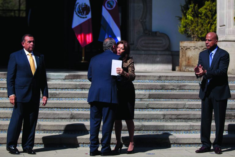 Mexico's President Felipe Calderon, with back to camera, greets Costa Rica's President Laura Chinchilla as Belize's Prime Minister Dean Barrow, right, and Honduras' President Porfirio Lobo look on after a press conference in Mexico City, Monday, Nov. 12, 2012. Mexico and the three Central American nations are calling for a review of international drug policies after two U.S. states voted to legalize recreational use of marijuana. (AP Photo/Alexandre Meneghini)