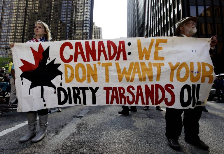 Demonstrators protest against the Keystone XL pipeline and the Alberta tar sands outside of the Canadian Consulate in Chicago in May 2012. (AP Photo/ Nam Y. Huh)