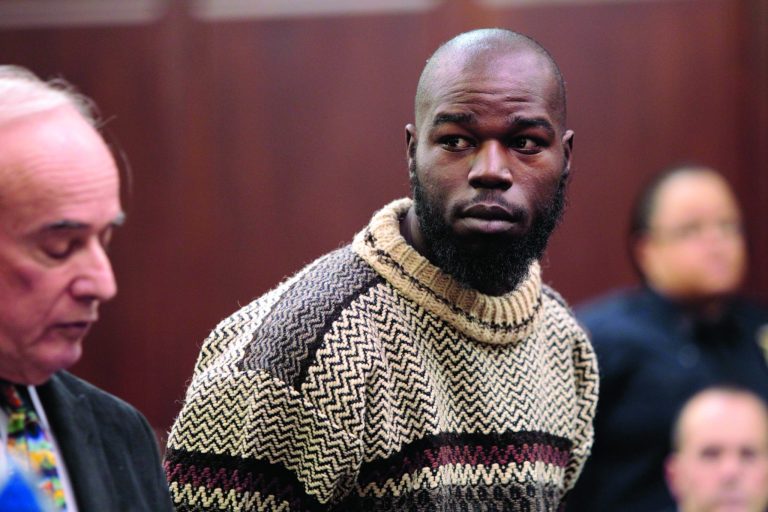 CORRECTS SOURCE - Naeem Davis stands in front of Judge Lynn Kotler during his arraignment on murder charges Wednesday, Dec. 5, 2012, in New York. Davis was arrested Tuesday in the death of 58-year-old New York city subway rider Ki-Suck Han, who was shoved onto the tracks. (AP Photo/New York Post, William C. Lopez, Pool)