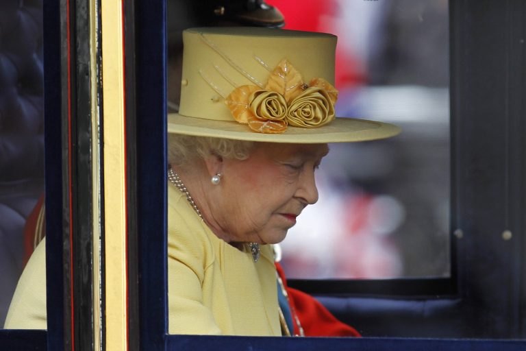   Britain's Queen Elizabeth II leaves Buckingham Palace on a horse drawn carriage for the Trooping The Colour at the Horse Guards Parade in London, Saturday, June 16, 2012. (AP Photo/Sang Tan)  