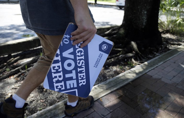 Today, four years after Obama won Florida, Iowa, North Carolina, Nevada, Ohio and Pennsylvania by over 618,000 votes, the number of registered Democrats in these states has plummeted by more than 775,000. (AP Photo/Lynne Sladky)