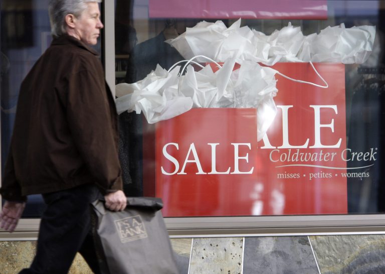 FILE - In this Oct. 6, 2009 file photo, a shopper walks past a Coldwater Creek store in downtown Seattle. The women's clothing retailer has filed for Chapter 11 bankruptcy protection after failing to find a potential buyer or a source of capital to help fund its turnaround efforts. The company said Friday April 11, 2014 that it expects to start sales to liquidate inventory in early May. It plans to hold going out of business sales in the coming months. (AP Photo/Elaine Thompson)
