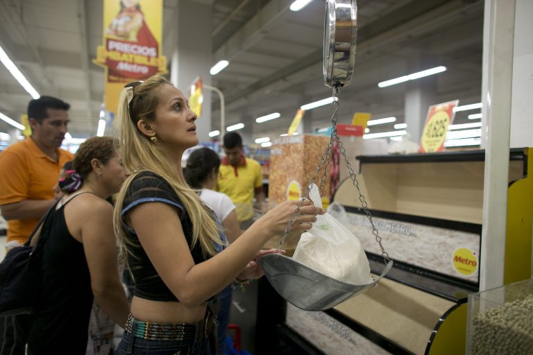 Chavez and Maduro turned to price controls in an attempt to wrestle the economy into compliance. (AP Photo/Ariana Cubillos)