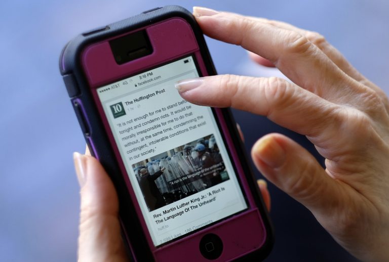 Most people spend more time on social media than they do watching or reading the news. (AP Photo/Richard Vogel, File)