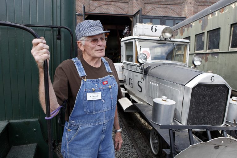   In this May 31, 2012 photo Al Blount a volunteer at the Colorado Railroad Museum in Golden, Colo., stands beside Golden Goose #6 as he talks about the history of the converted automobiles. Six out of seven of the Galloping Geese that were built by the railroads in the 1930s are scheduled to be on display at the museum this weekend. (AP Photo/Ed Andrieski)  