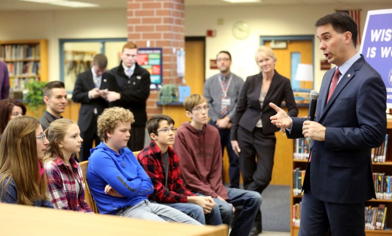 There's no dignified way to deal with the kind of heckling and death threats that Walker received. (AP/Telegraph Herald/Jessica Reilly)