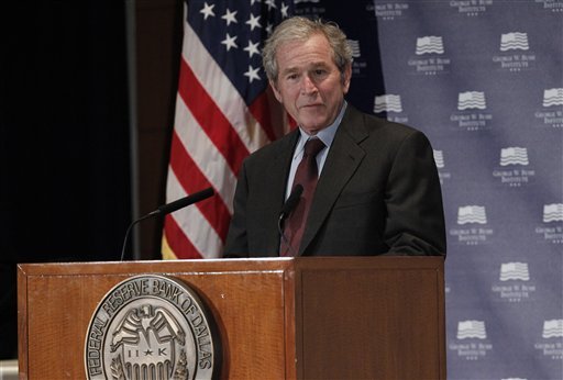 Former President George W. Bush gives opening remarks at the Federal Reserve Bank of Dallas for a conference titled 