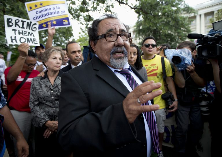 Rep. Raul Grijalva, D-Ariz., center, joins immigration reform supporters as they block a street on Capitol Hill in Washington, Thursday, Aug. 1, 2013, during a rally protesting immigration policies. (AP Photo/Manuel Balce Ceneta)