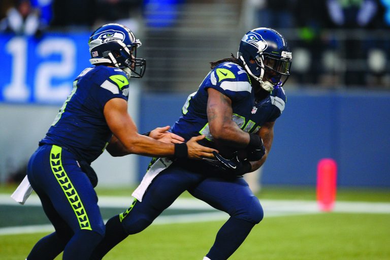 Kevin Casey/Getty Images
Russell Wilson, left, and Marshawn Lynch combined for 199 yards rushing as the Seahawks rallied past the Redskins on Sunday.