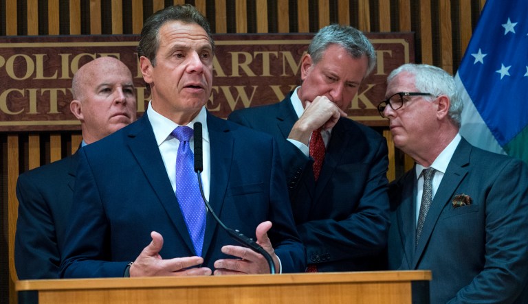 New York Gov. Andrew Cuomo speaks during a news conference, Wednesday, Nov. 1, 2017, at One Police Plaza in New York in the wake of a truck attack on a bike path that killed eight and injured several others Tuesday near One World Trade Center. From left are New York Police Commissioner James P. O'Neill, Cuomo, New York City Mayor Bill de Blasio, and Deputy Commissioner of Intelligence and Counter-terrorism John Miller. (AP Photo/Craig Ruttle)