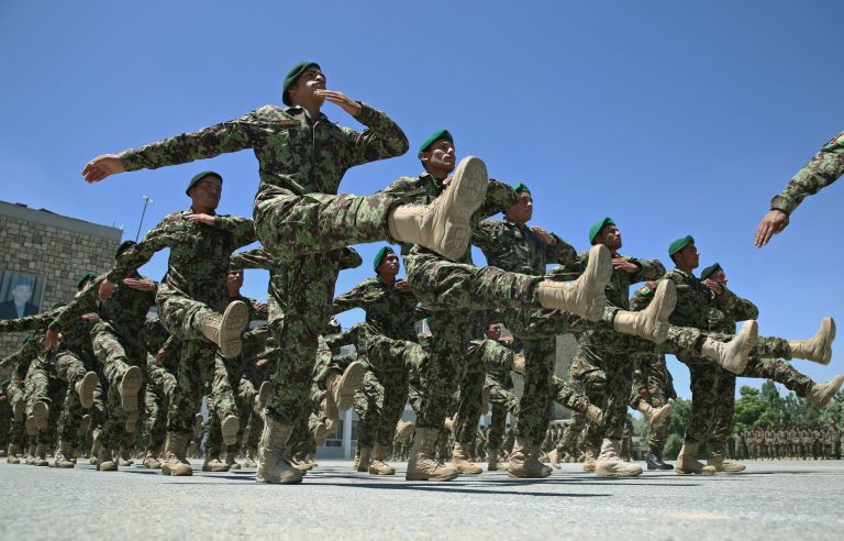 FILE - In this June 1, 2014 file photo, Afghanistan National Army soldiers march during their graduation ceremony at the Kabul Military Training Center in Kabul, Afghanistan. An Afghan army desperate for more advanced military equipment is suffering death rates 30 percent higher in the 2014 fighting season, the army's first against the Taliban without large-scale assistance from the U.S.-led international military force, officials said. (AP Photo/Massoud Hossaini, File)