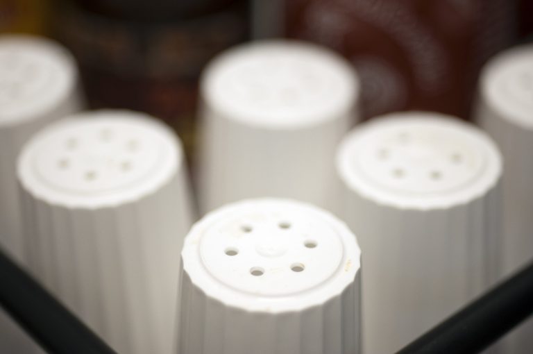 FILE - This May 14, 2013 file photo shows salt shakers at a restaurant in Alexandria, Va. A large international study challenges the advice for most people to cut back on salt. Unless they have high blood pressure, the amount most folks consume is OK for heart health, and too little may be as bad as too much, the study suggests. (AP Photo/Cliff Owen, File)